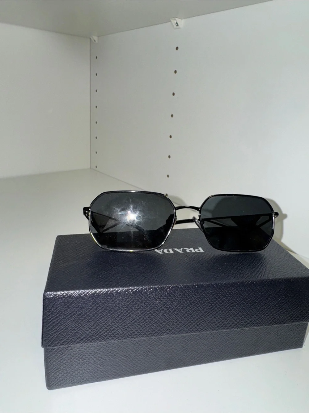 Prada Women’s Black Metal Frame Sunglasses with Dark Lenses